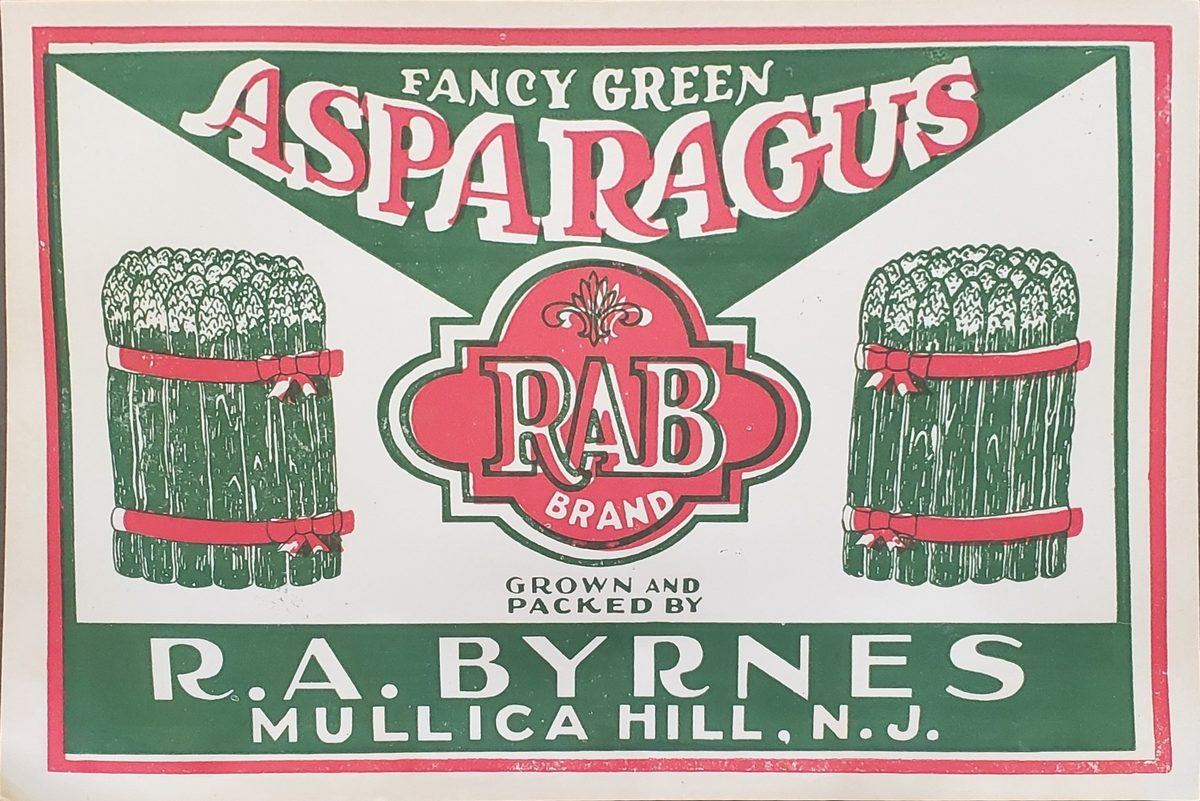 A green and red crate label reading Fancy Green Asparagus, two bundled sheaves flanking the R. A. Byrnes brand mark.