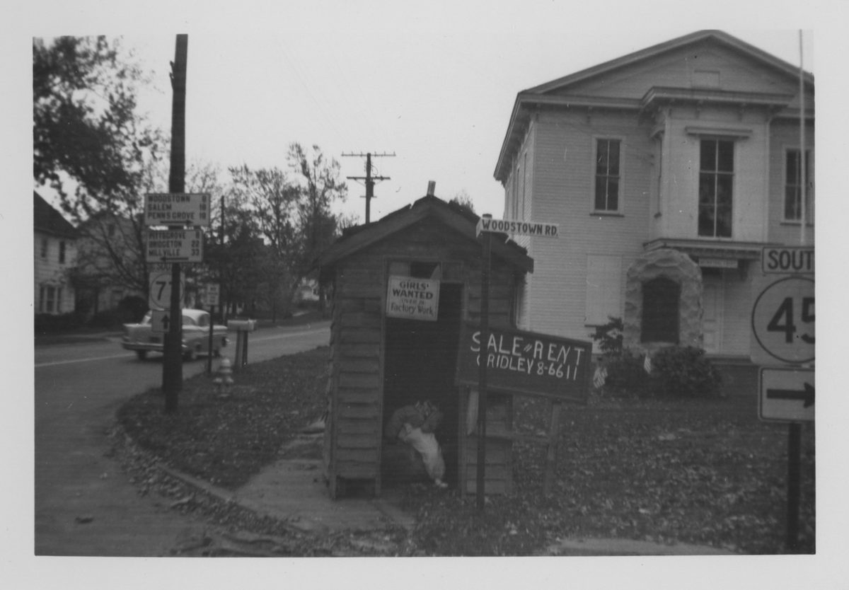 Old Town Hall, circa 1950, with an outhouse placed in front by Mischief Night pranksters